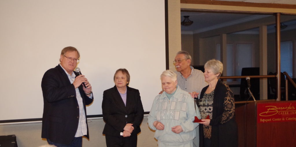 Ken, Kim, and Cora presenting Linda and Earl Kalb the Volunteer of the Year Award for 2017.